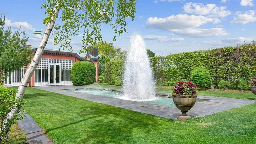 Tour This Majestic 1937 Estate in Greenwich with Tennis House, Ethereal Fountains, and 22 Acres of Beautifully Designed Land