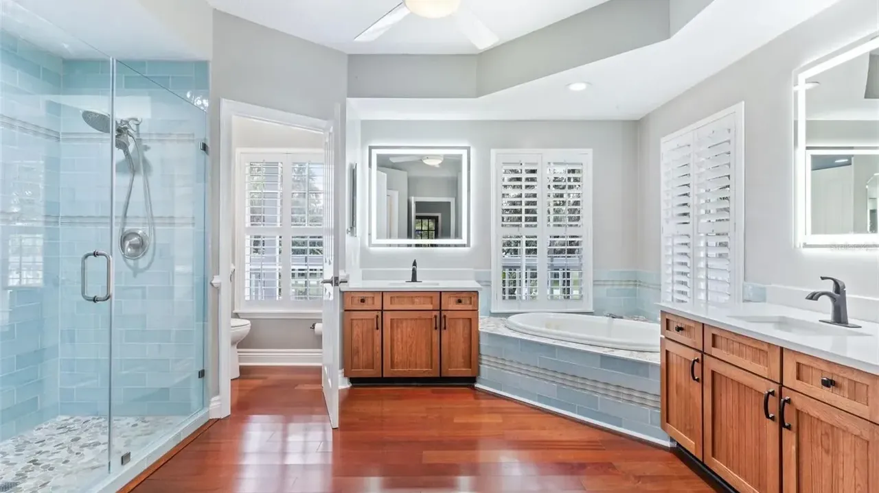 Tour This Stunning 1992 4-Bedroom Key West Style Home with Wraparound Porch in Oldsmar, FL (Floor Plan Included)
