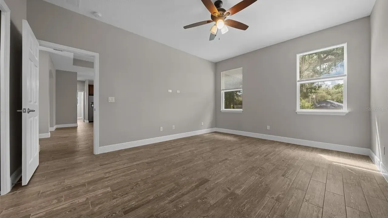 Discover This Bright and Open 3-Bedroom 1,685 Sq-Ft Ranch-Style Home with Granite Counters and Large Pantry in Groveland, FL (Floor Plan Inside)