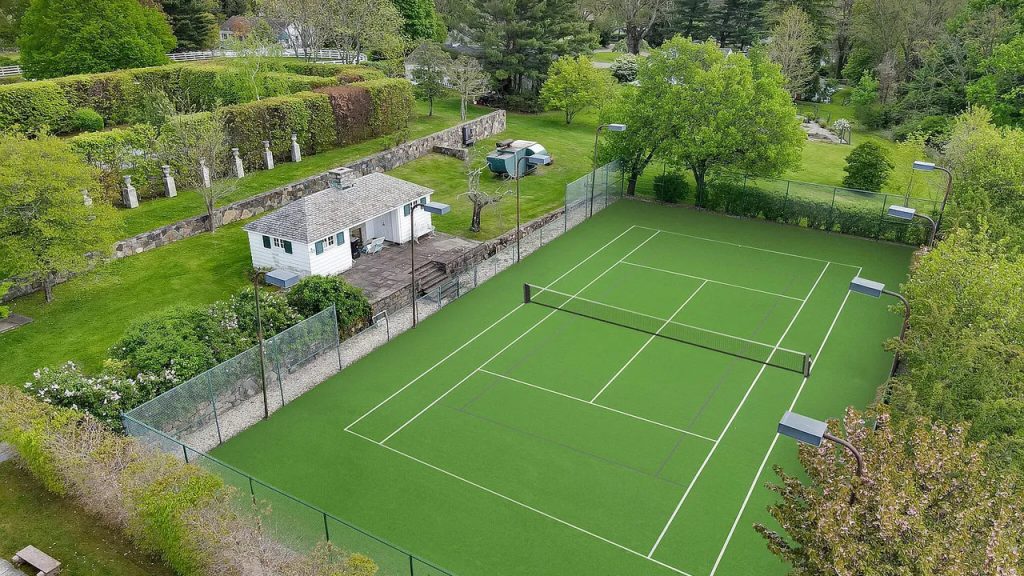 Tour This Majestic 1937 Estate in Greenwich with Tennis House, Ethereal Fountains, and 22 Acres of Beautifully Designed Land