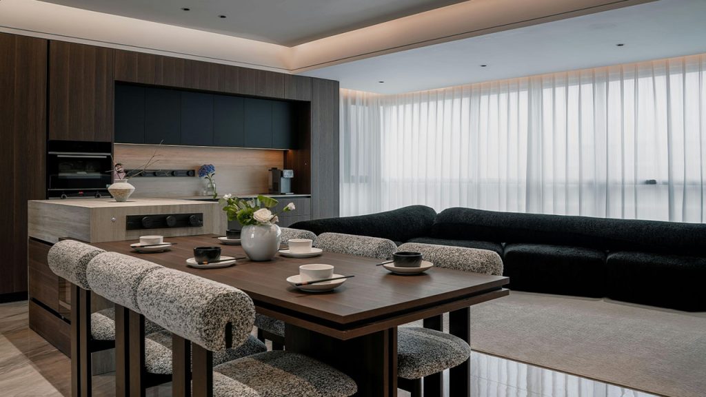 A modern kitchen and dining area with a large table