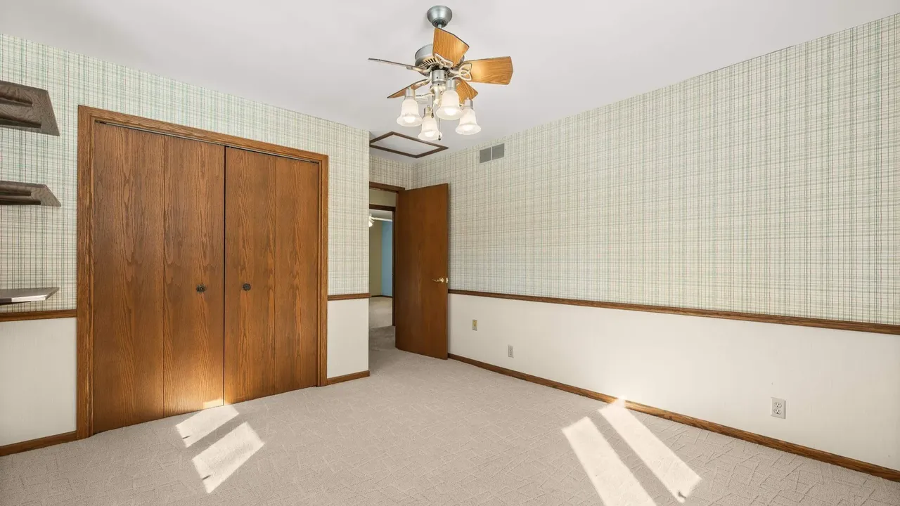 Experience Country Living in This 3-Bedroom Tudor with Garden and Wooded Trails in Stevens Point Wisconsin (Floor Plan Inside)