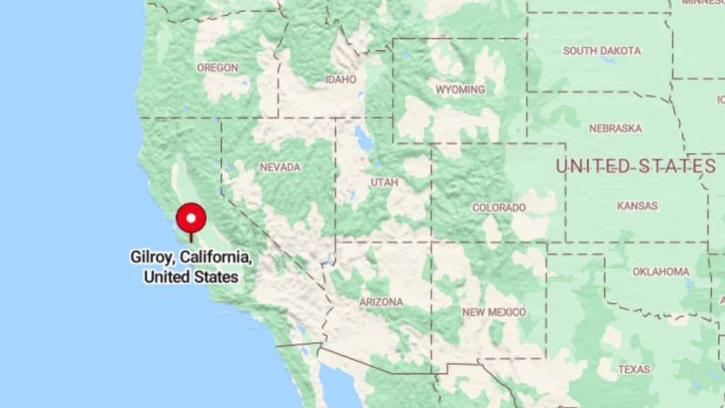 A map of the western United States with a red pin marking Gilroy, California, near the Pacific coast, surrounded by states like Nevada, Oregon, and Arizona.