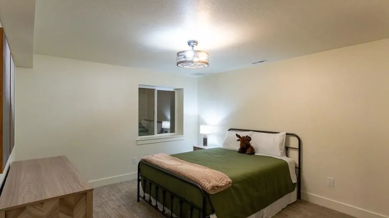 Discover Modern Comfort in This 6-Bedroom Cabin Nestled Among Towering Pine Trees Near Yellowstone! (Floor Plan Included)