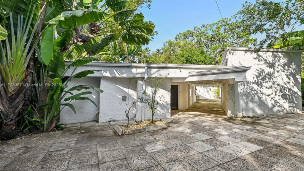 Tropical Stucco Exterior with Breezeway