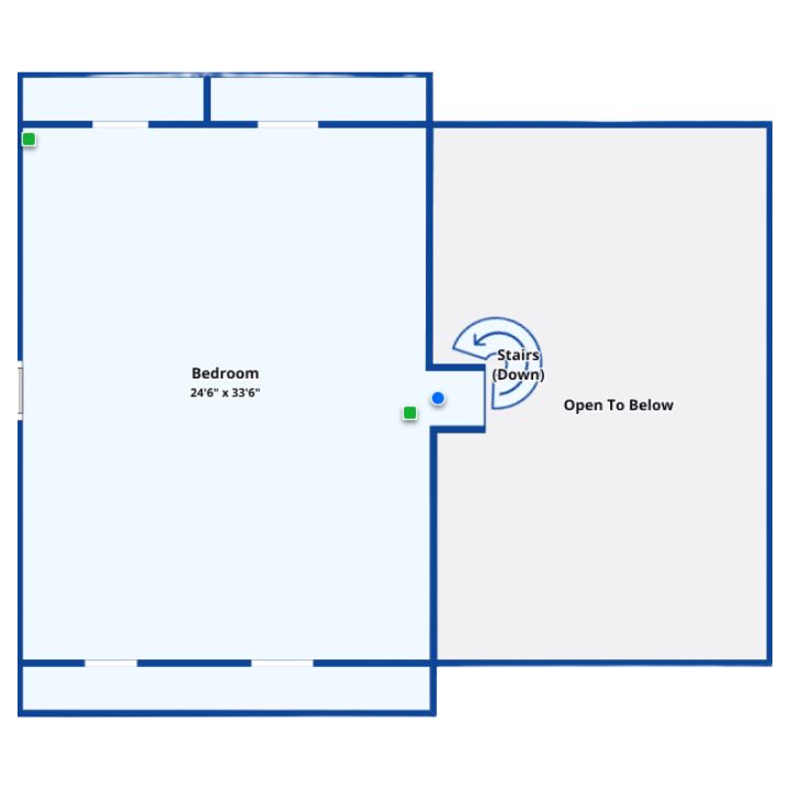 Upper floor with large bedroom and overlook to the space below.