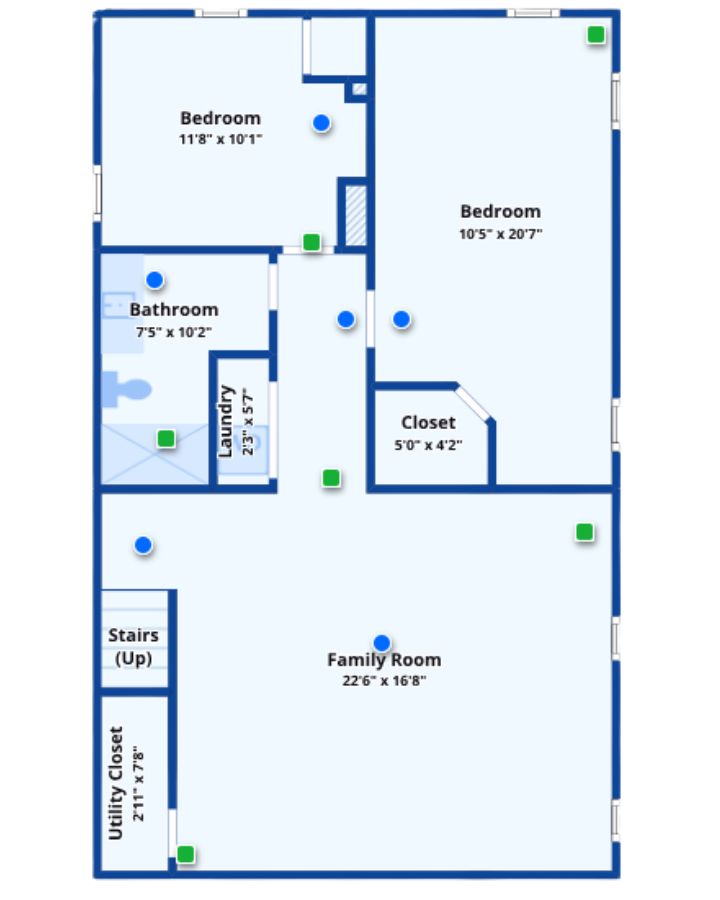 Lower floor plan with two bedrooms and a large family room.