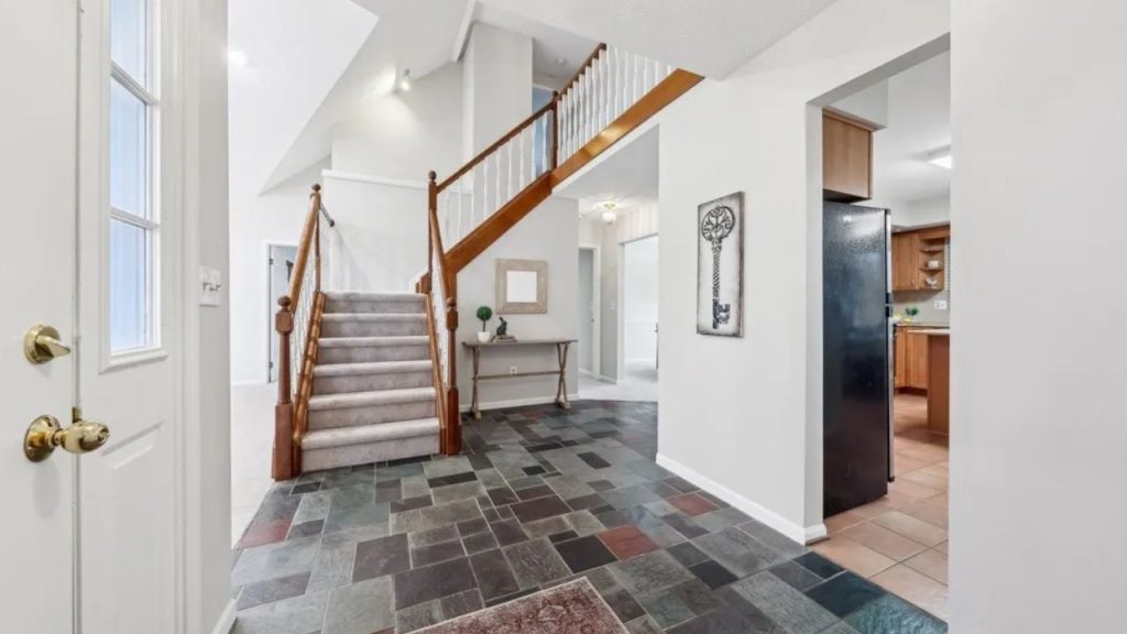 Welcoming Entry with Statement Staircase