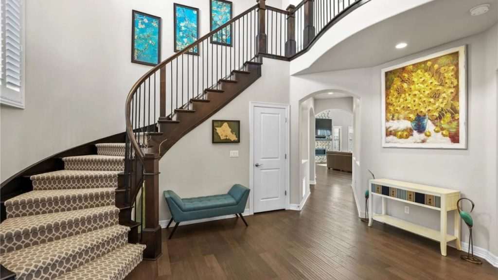 Elegant Foyer with Curved Staircase