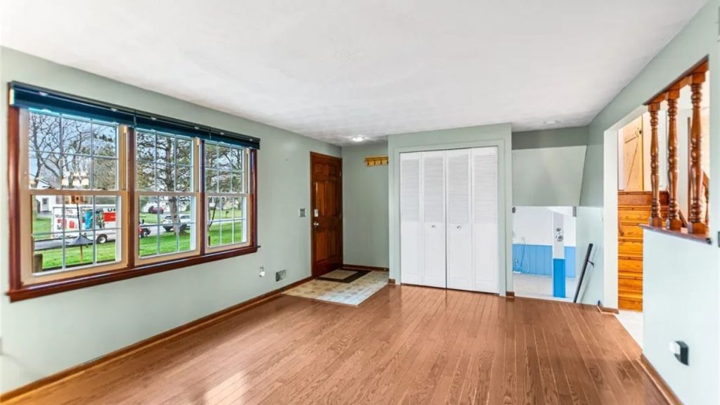 Sunlit Living Room with Entry Closet
