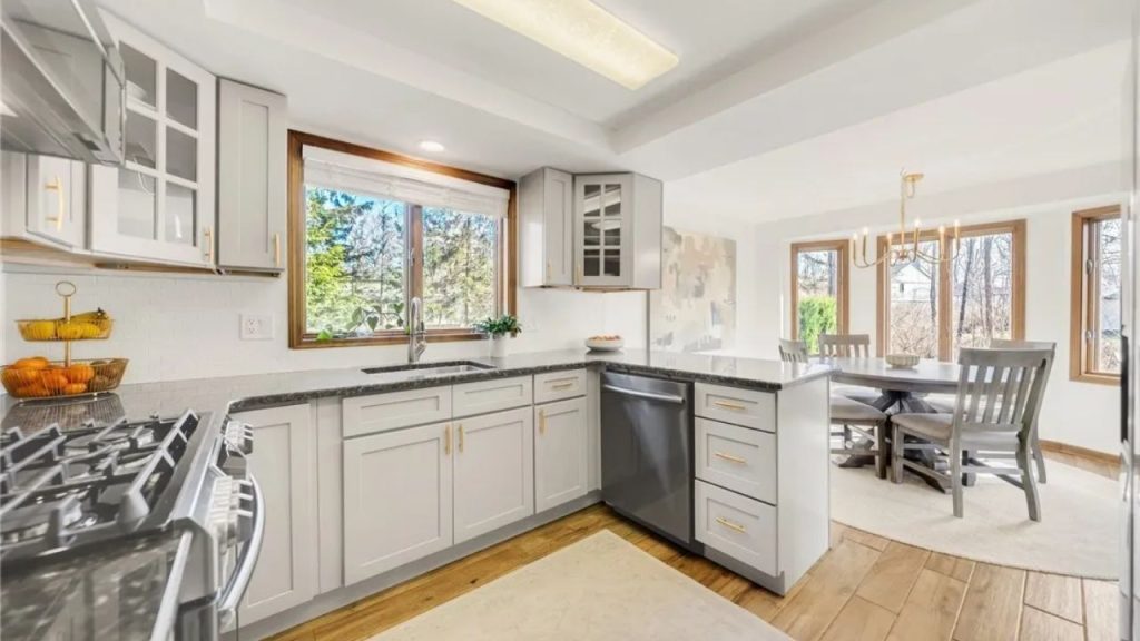 Bright kitchen with wood floors and sunny dining nook.