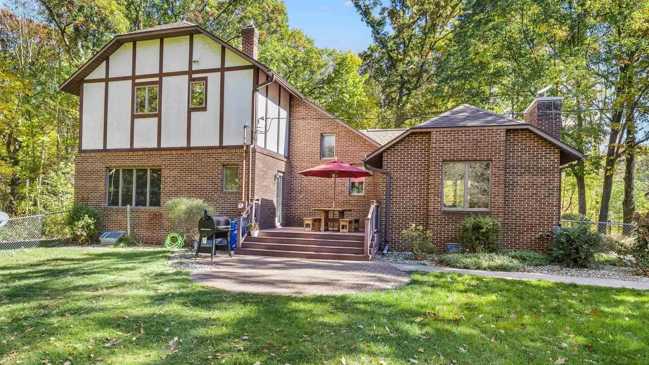 Experience Country Living in This 3-Bedroom Tudor with Garden and Wooded Trails in Stevens Point Wisconsin (Floor Plan Inside)