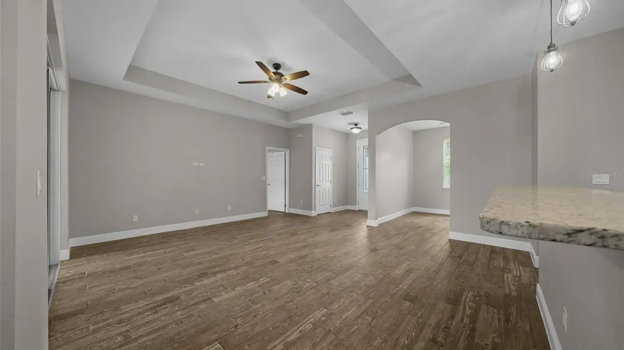Discover This Bright and Open 3-Bedroom 1,685 Sq-Ft Ranch-Style Home with Granite Counters and Large Pantry in Groveland, FL (Floor Plan Inside)