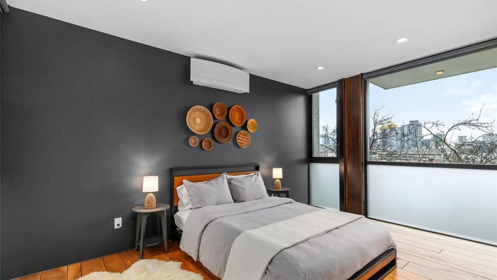 Skyline-Facing Bedroom with Dark Accents