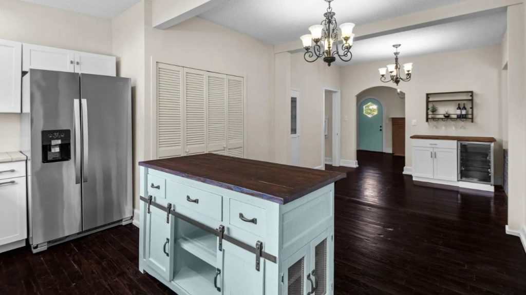 Charming Kitchen with a Vintage Island and Open Flow