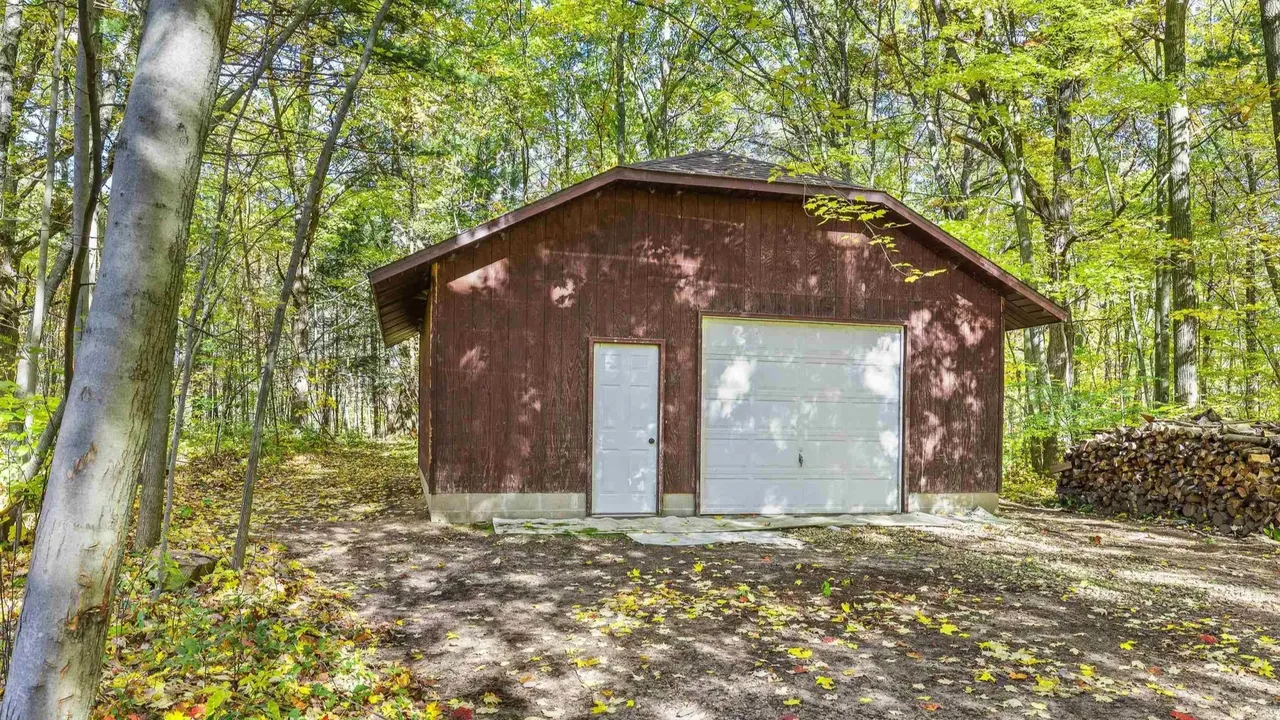Experience Country Living in This 3-Bedroom Tudor with Garden and Wooded Trails in Stevens Point Wisconsin (Floor Plan Inside)
