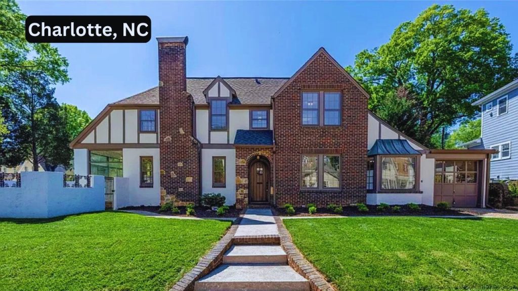 Brick and stucco Tudor-style home with steep gable roof in Charlotte, NC.