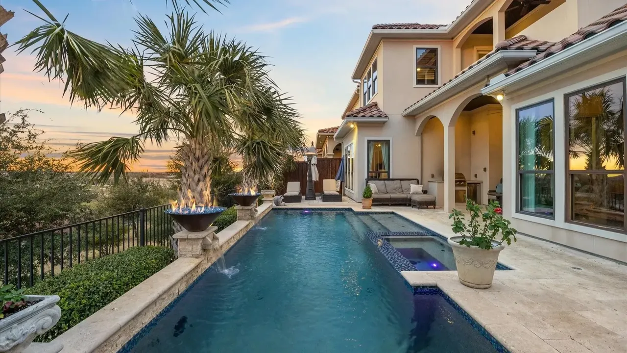 Explore This Elegant Mediterranean Retreat With Soaring Ceilings, Marble Floors, and Poolside Paradise (Floor Plan Inside)