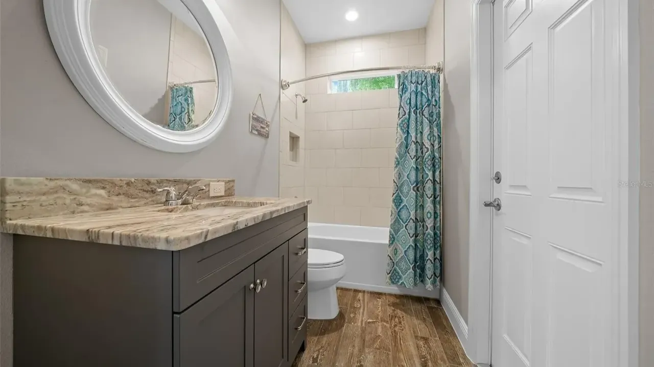 Discover This Bright and Open 3-Bedroom 1,685 Sq-Ft Ranch-Style Home with Granite Counters and Large Pantry in Groveland, FL (Floor Plan Inside)