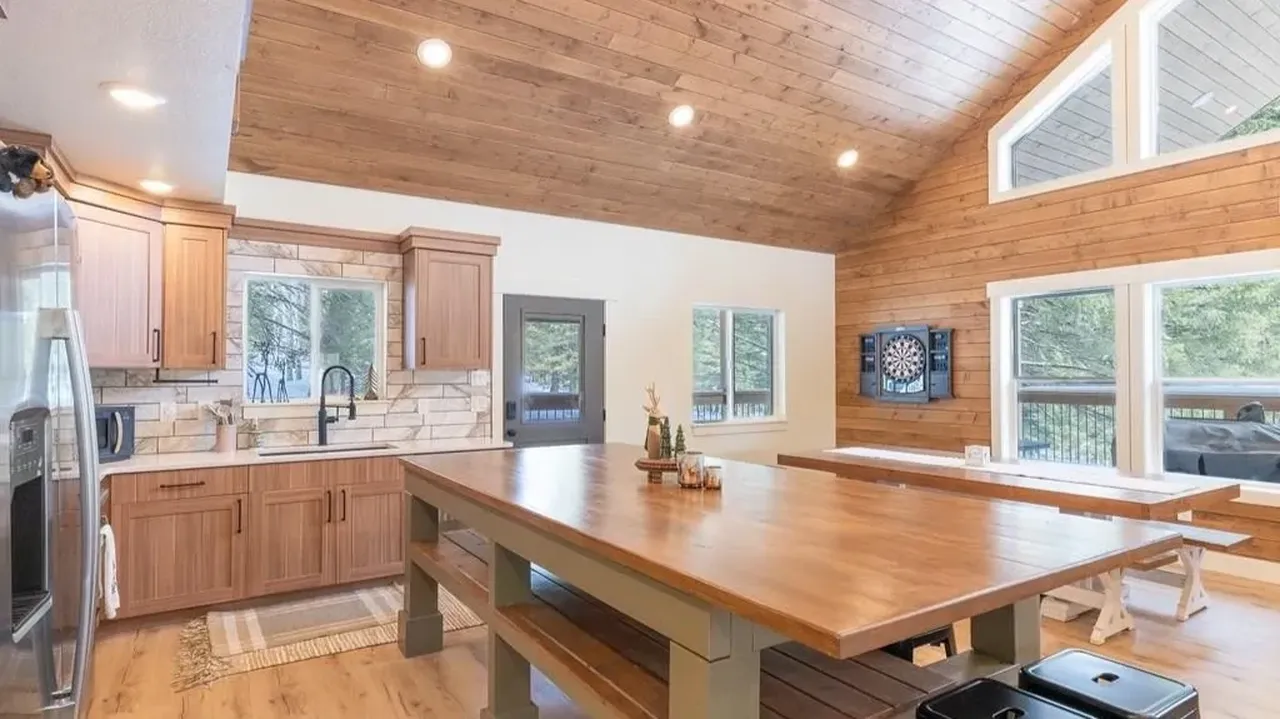 Discover Modern Comfort in This 6-Bedroom Cabin Nestled Among Towering Pine Trees Near Yellowstone! (Floor Plan Included)