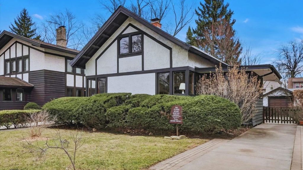 Tudor-style single-family home with trimmed shrubs in Chicago’s Beverly neighborhood.