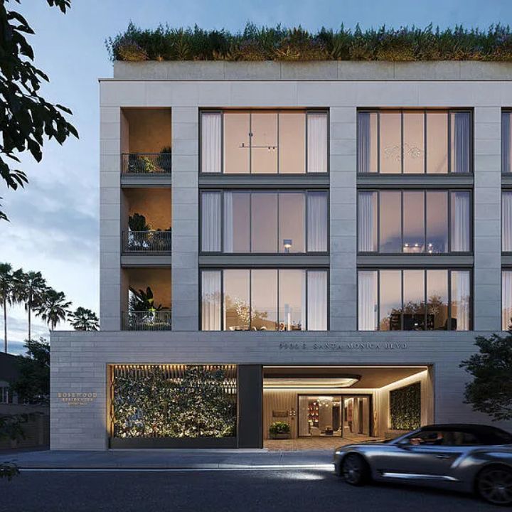 Elegant Beverly Hills penthouse building with large glass windows and modern design.