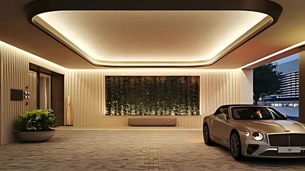 Covered luxury car entrance with soft lighting and vertical garden.