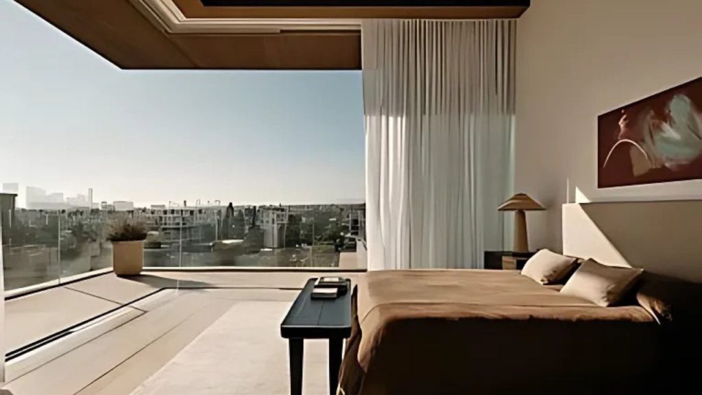 A modern penthouse bedroom with a glass wall view of the city, featuring a minimalist bed, sheer curtains, and an outdoor terrace.