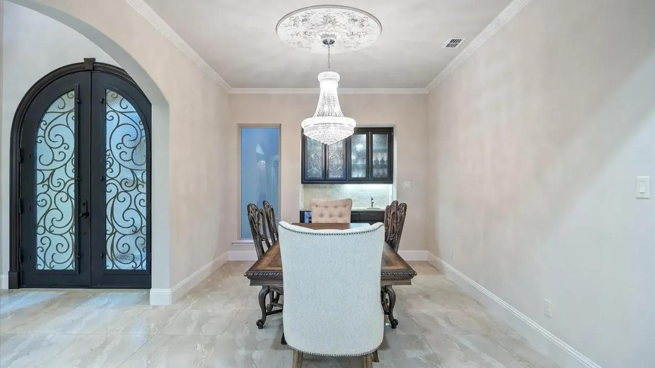 Explore This Elegant Mediterranean Retreat With Soaring Ceilings, Marble Floors, and Poolside Paradise (Floor Plan Inside)