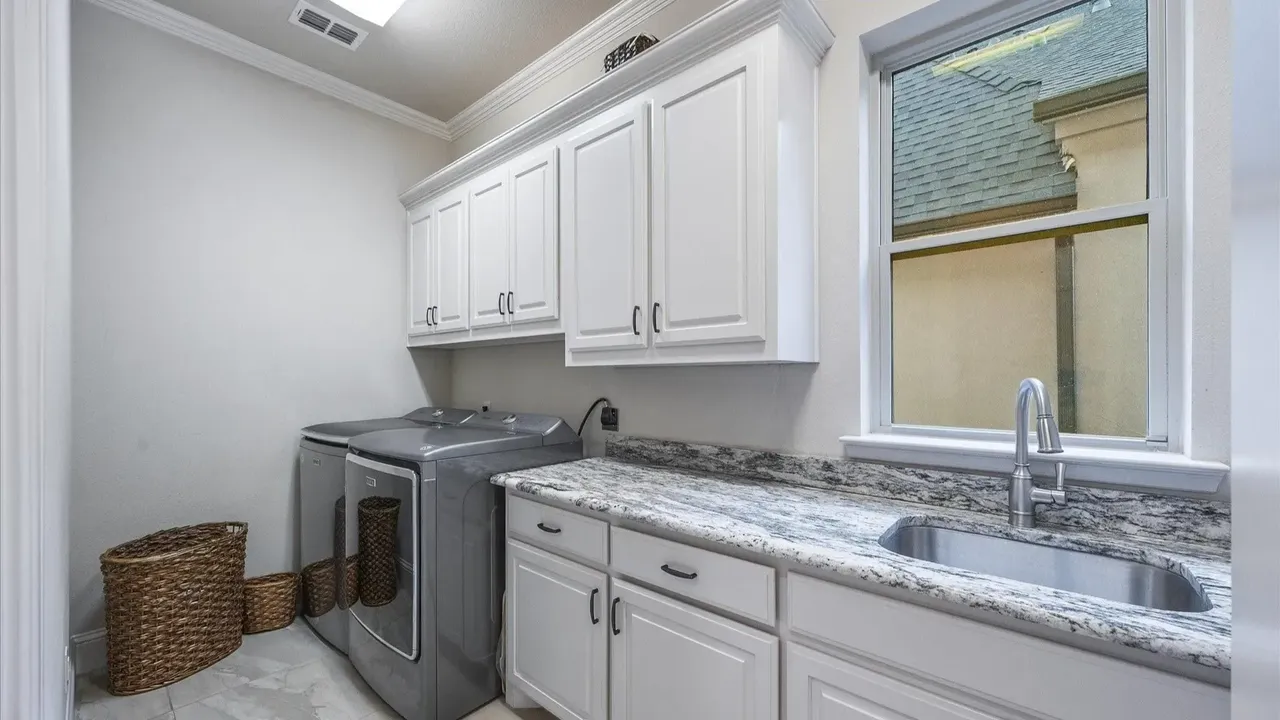 Explore This Elegant Mediterranean Retreat With Soaring Ceilings, Marble Floors, and Poolside Paradise (Floor Plan Inside)
