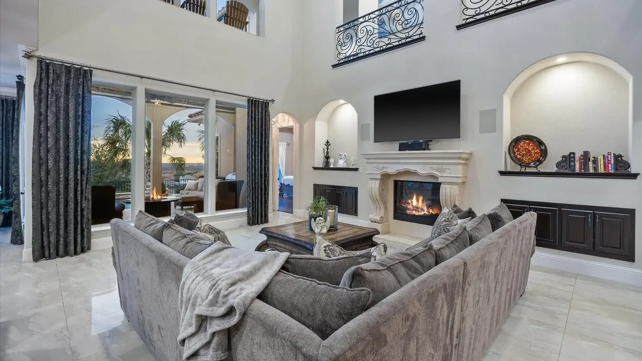 Explore This Elegant Mediterranean Retreat With Soaring Ceilings, Marble Floors, and Poolside Paradise (Floor Plan Inside)