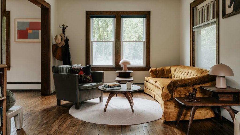 A living room filled with furniture and a wooden floor