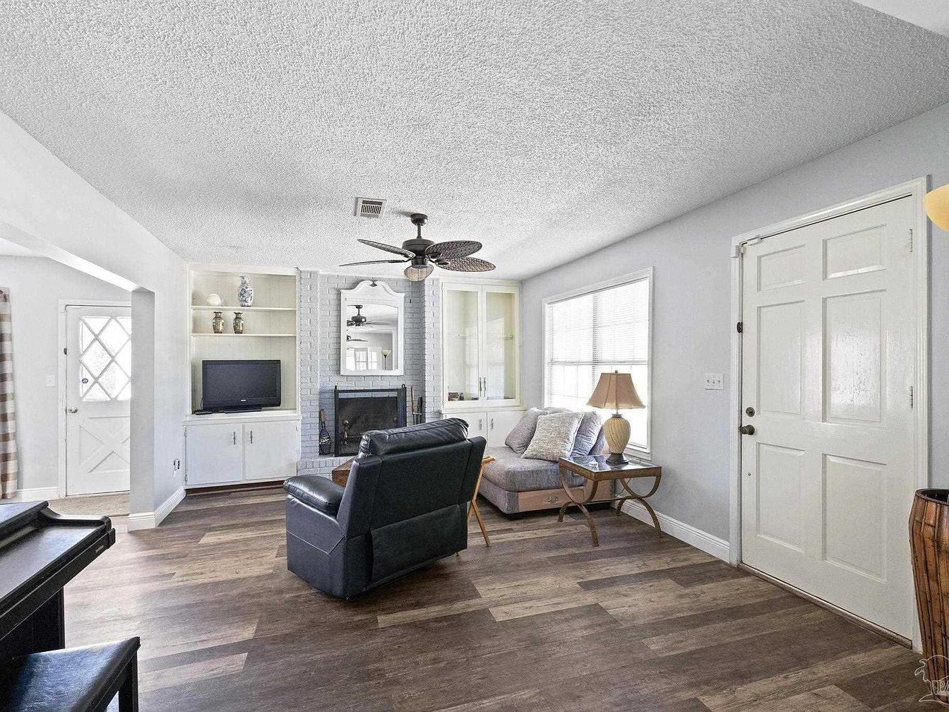 Living room with fireplace, TV, and seating area