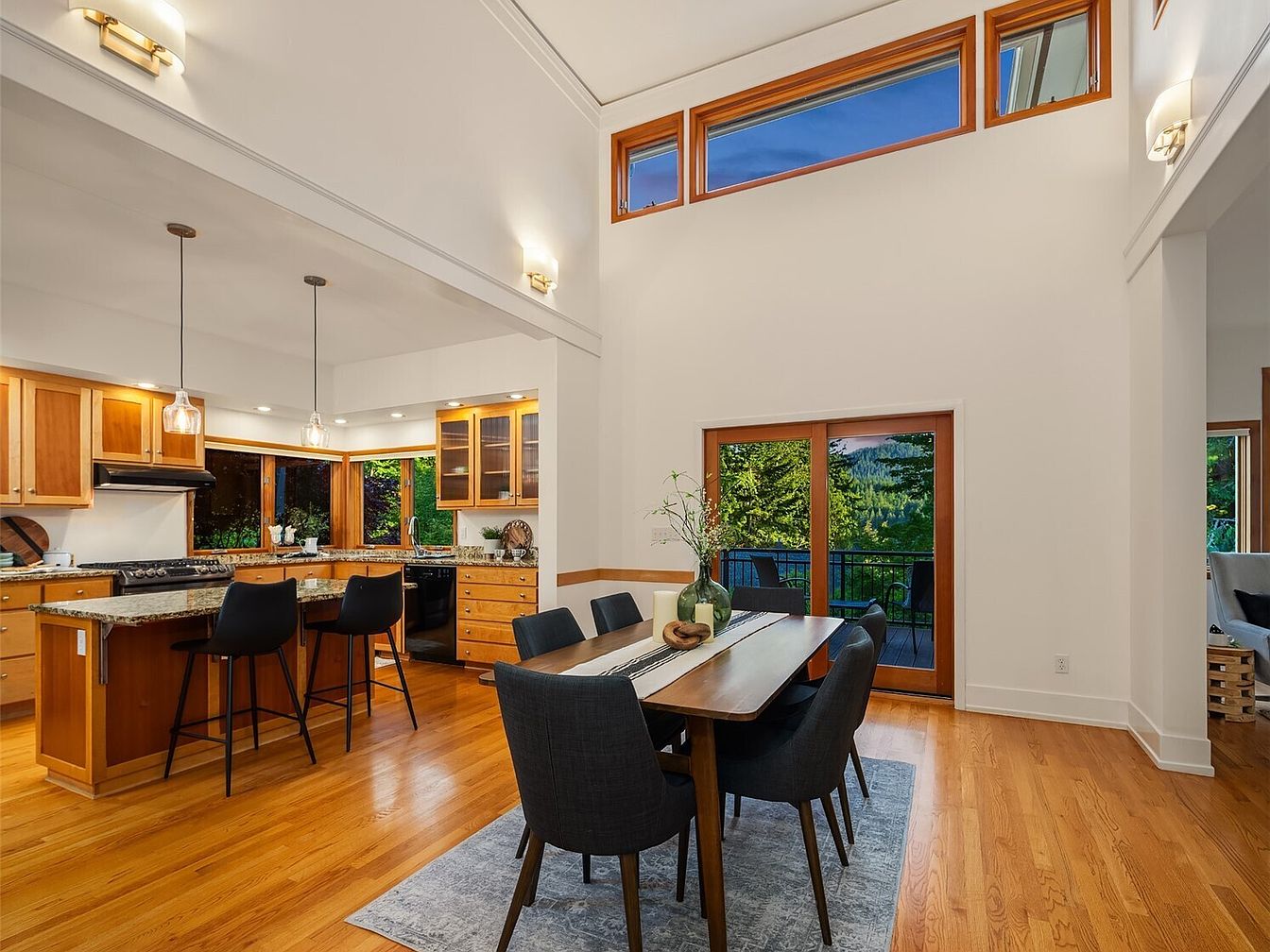 Dining Area and Kitchen with wood accents and modern furniture