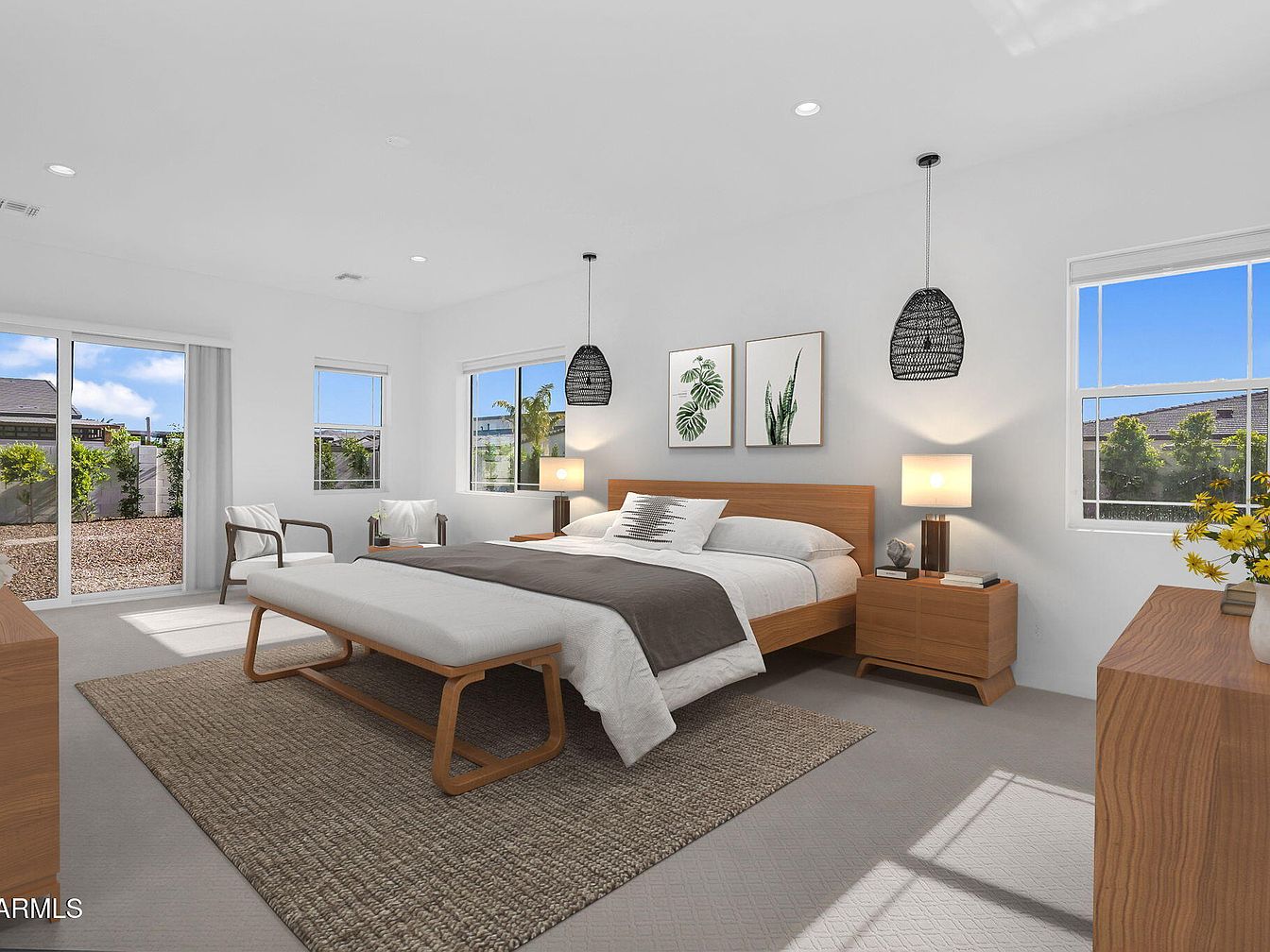 Spacious master bedroom with wooden furniture and natural light